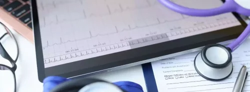 Digital patient chart and ECG monitoring displayed on a tablet.