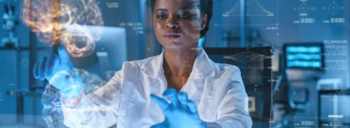 Clinician interacting with a digital brain visualisation in a laboratory setting.