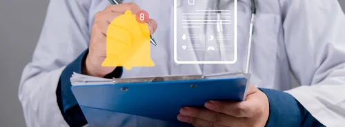 Clinician managing digital patient records with alert notifications, illustrating clinical documentation, workflow management and timely decision support.