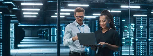 Healthcare IT professionals reviewing data centre infrastructure, supporting cloud systems, cybersecurity and secure medical data management.