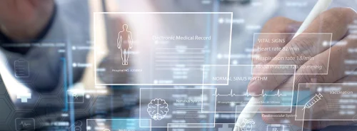 Doctor using electronic medical record technology, supporting digital patient data management, clinical documentation and connected care.