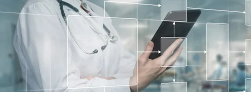 Doctor using digital healthcare workflow diagram, supporting care coordination, process mapping, interoperability and clinical data management.
