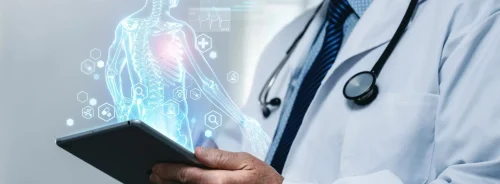 Clinician using digital patient model, supporting connected care, diagnostic review, clinical analytics and personalised treatment planning.