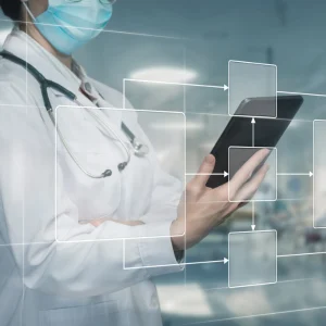 Doctor using digital healthcare workflow diagram, supporting care coordination, process mapping, interoperability and clinical data management.