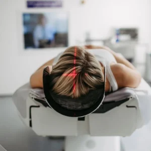 Patient being prepared for CT imaging, supporting radiology workflow, diagnostic assessment, scan coordination and patient care services.