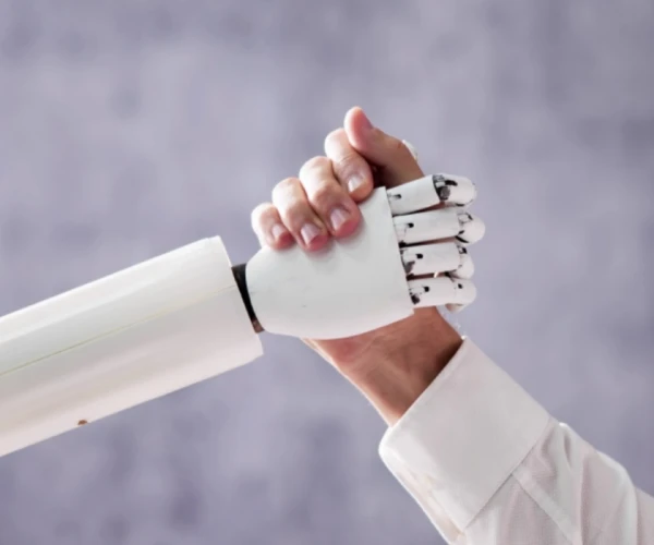 Human–AI collaboration symbolising integration of robotics and artificial intelligence in healthcare innovation.