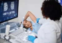 Radiologist performing an ultrasound-guided breast biopsy for precise diagnosis.