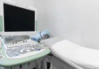Ultrasound machine in medical examination room prepared for patient diagnostic imaging 