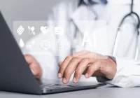 Clinician uses AI tools on a laptop to support care and documentation. 