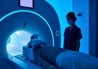 Modern MRI machine with a patient undergoing diagnostic imaging in radiology. 