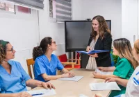 Medical staff briefing reviewing clinical governance 