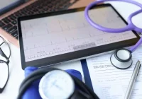 Digital patient chart and ECG monitoring displayed on a tablet.