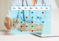 Doctor using digital calendar for healthcare scheduling, supporting appointment planning, clinical workflow management and care coordination.