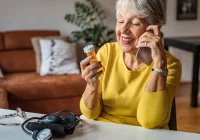 Older patient calling about medication at home, supporting pharmacy advice, medicine safety and remote healthcare support.