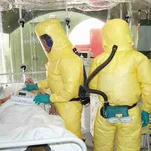 Patient with Ebola in isolation, staff in protective equipment