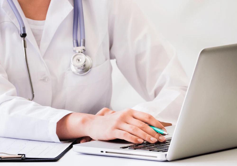 Female Doctor Using Laptop – Modern Healthcare and Digital Patient Management