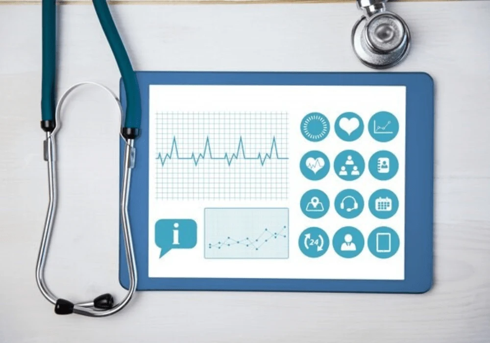 Digital tablet displaying health data and medical icons for telemedicine and monitoring 