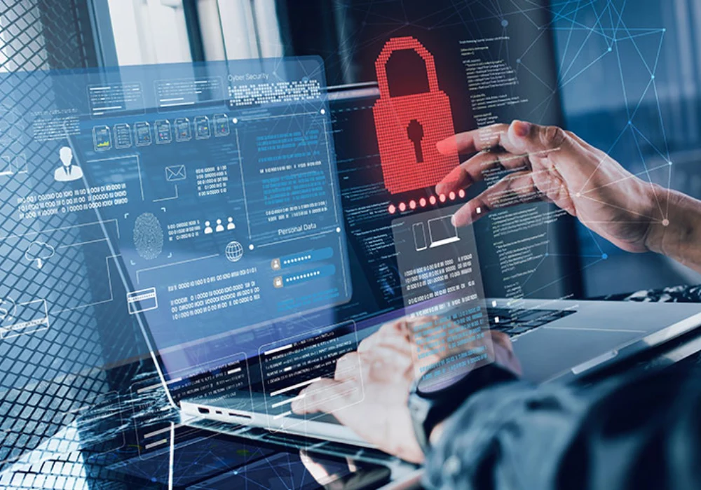 Professional interacting with a cybersecurity interface on a laptop, illustrating data protection, threat monitoring and secure management of digital information within healthcare IT environments.