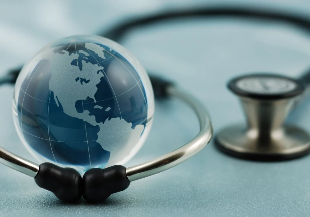 Global health concept with a stethoscope and world globe, symbolising international healthcare, public health and medical cooperation.