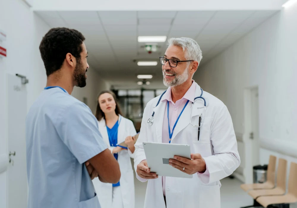 Healthcare professionals reviewing information, supporting clinical teamwork, care coordination and hospital management.