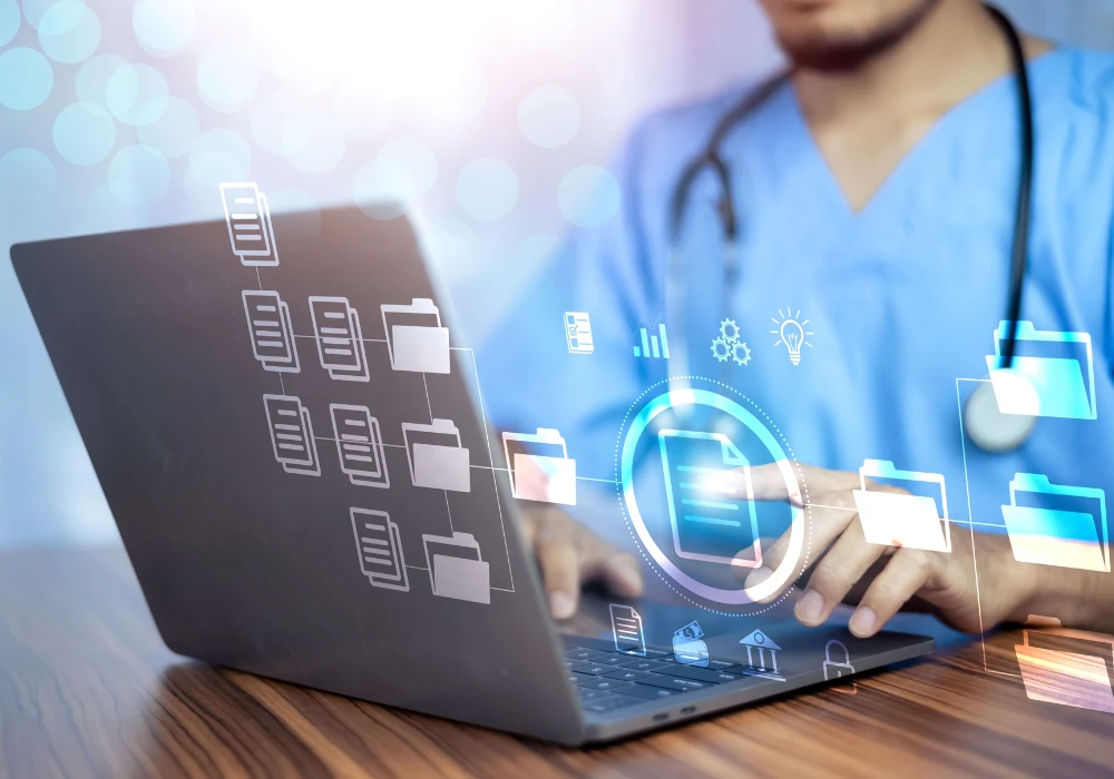 Healthcare professional using laptop with imaging records, supporting clinical documentation, diagnostic review, digital workflows and care coordination.