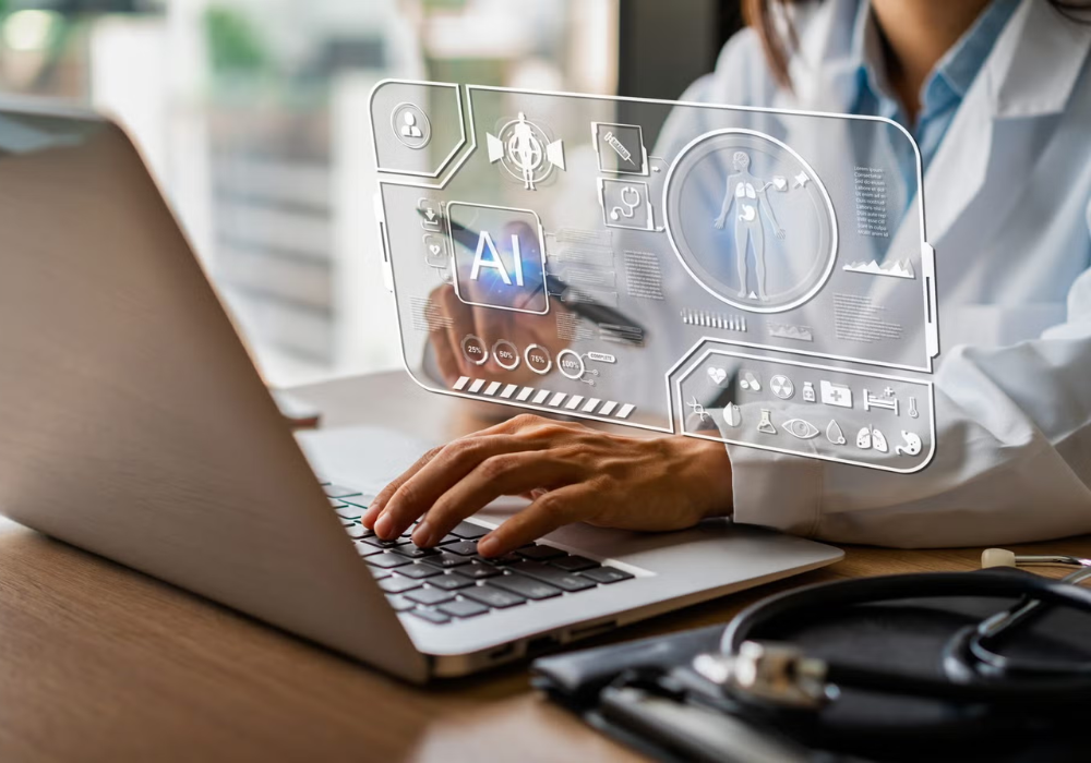Doctor using AI-enabled healthcare technology on a laptop, supporting clinical decision support, digital care coordination and medical data management.