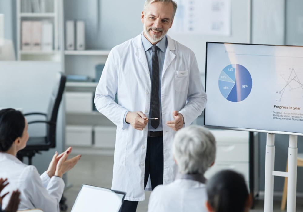 Physician presenting clinical performance data, supporting hospital leadership, medical team training and healthcare management.