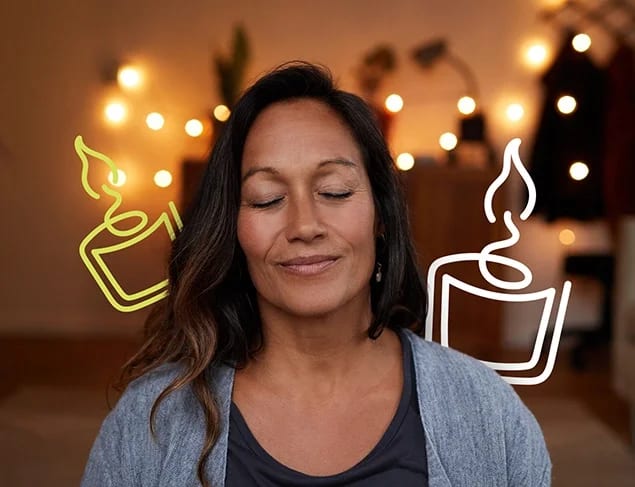 Calm woman meditating in a softly lit room