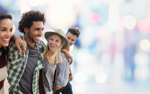 Photo of a smiling group of four friends