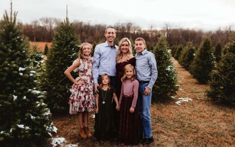 Group of people in field of xmas trees