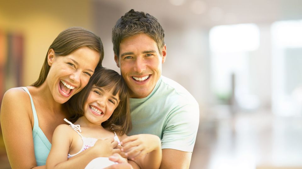 Photo of family smiling