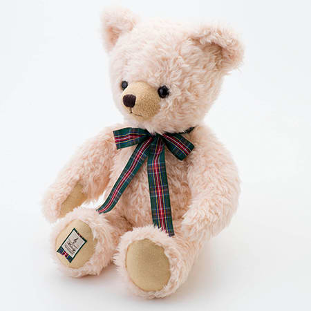 丸筒電報をしっかり抱えたくまのメロディ