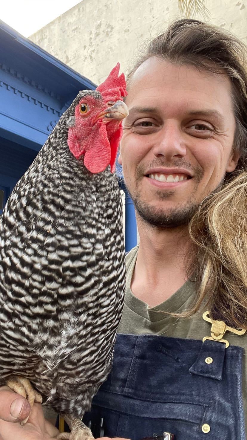 HeirloomPotager_Consultant_MatthewHarr w one of his chickens