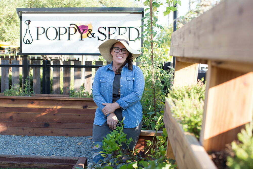 HP_PoppySeed_163L_web Ashley Irene, the Heirloom Potager, wearing garden hat in the Poppy & Seed chef's garden | Photo by Nicole Kent