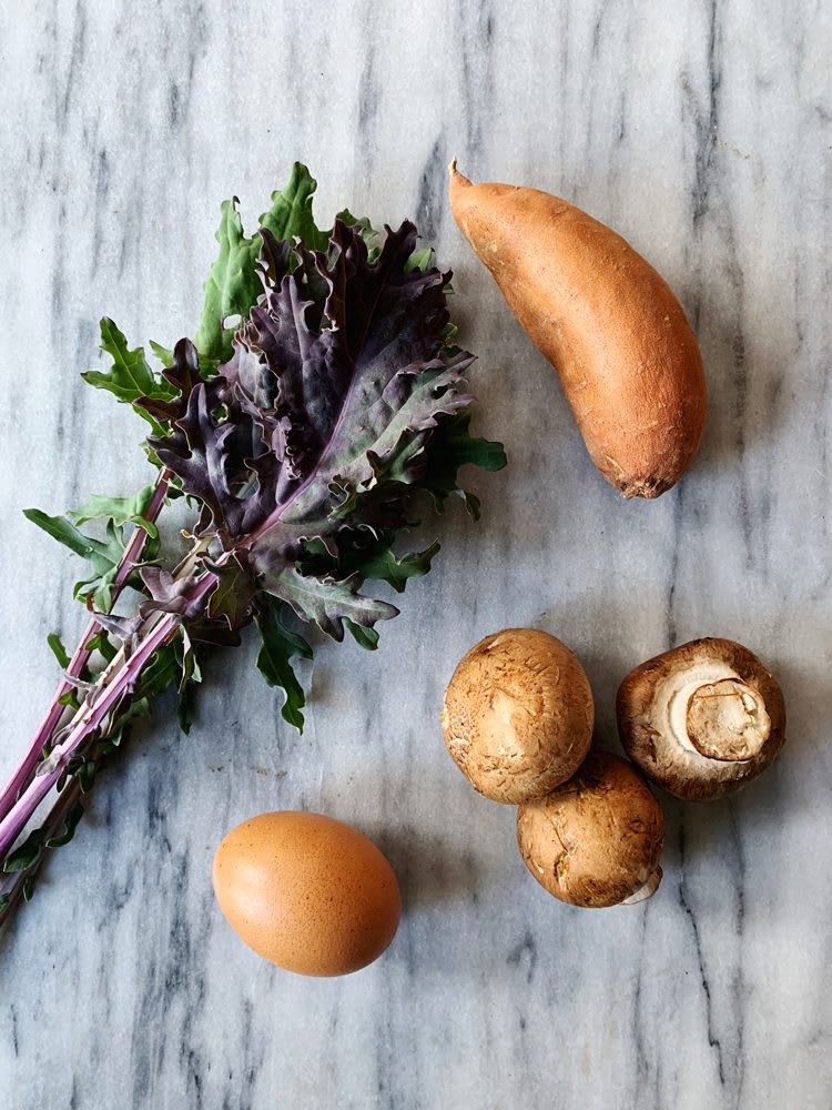 HeartyBreakfastHash_Ingredients_web Hearty breakfast hash ingredients: kale, sweet potato, mushrooms, and one egg