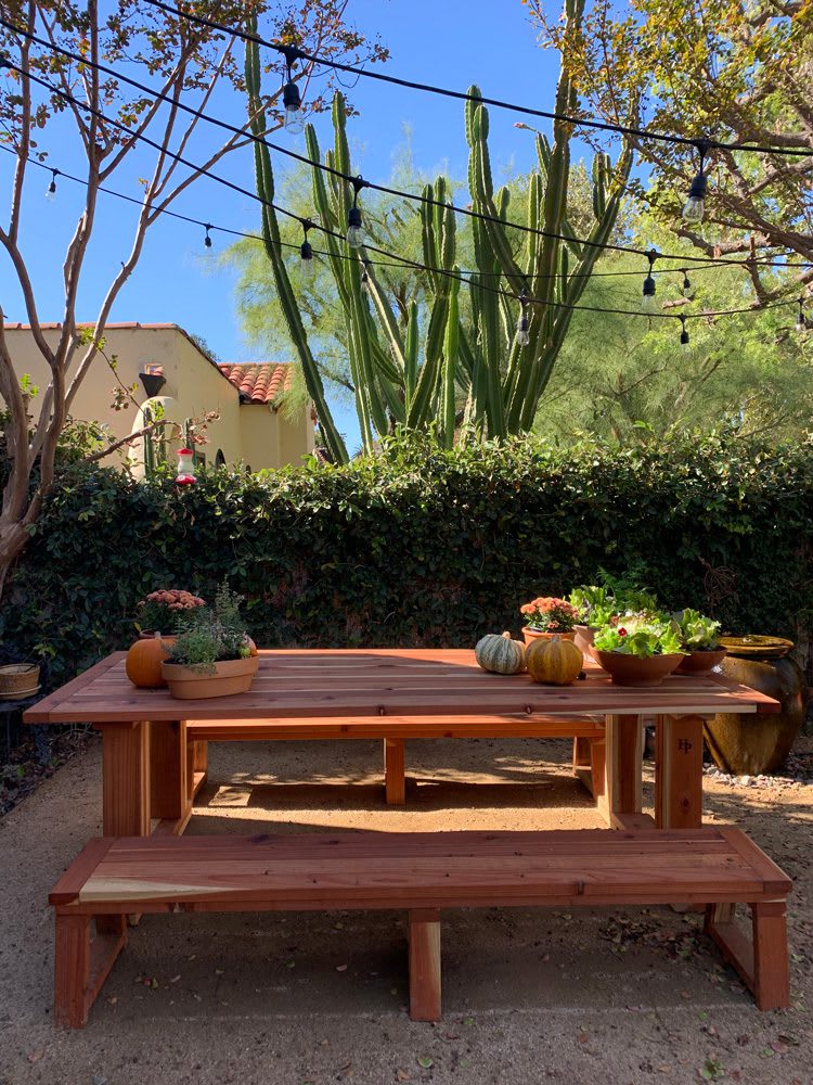 HP_SG_DiningTable_Daytime_web Heirloom Potager Showcase Garden Outdoor Dining Room during the day with fall themed planters on display