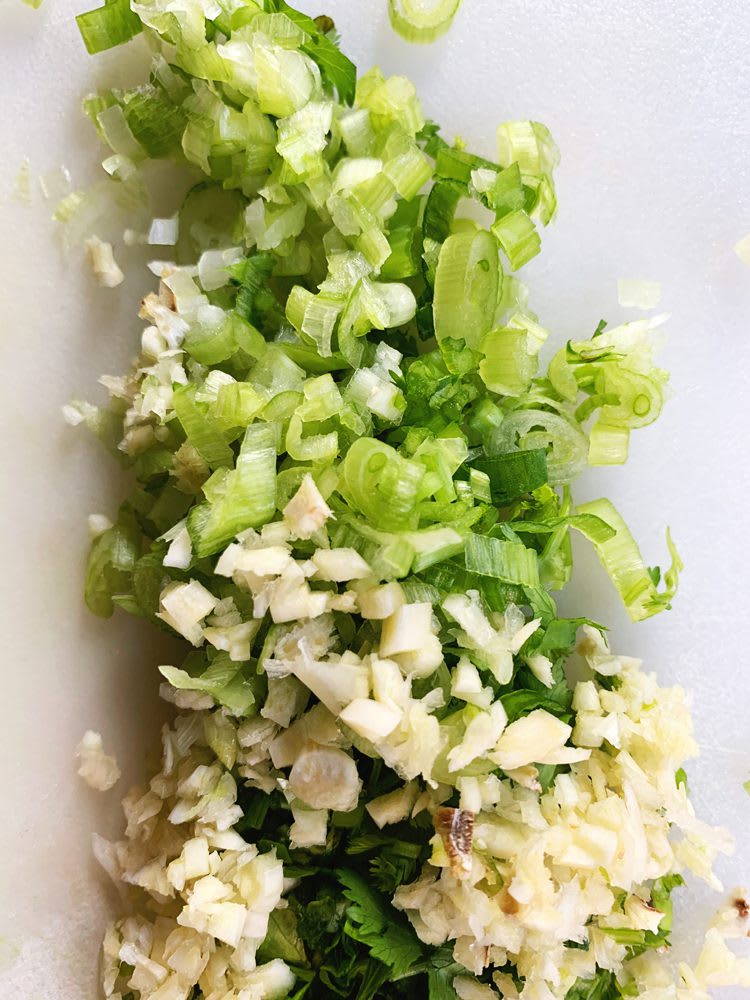 SalmonBurgers_Prep_web Minced green onions, garlic, and cilantro stems