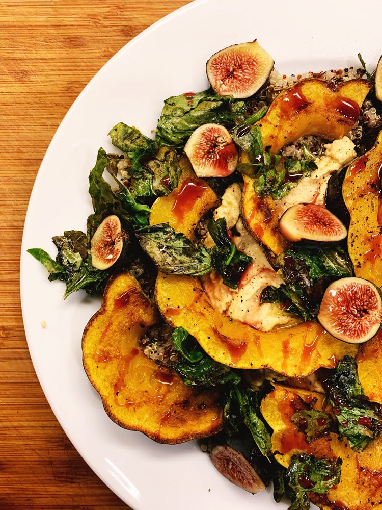 Roasted Acorn Squash, Kale, Quinoa on a white plate