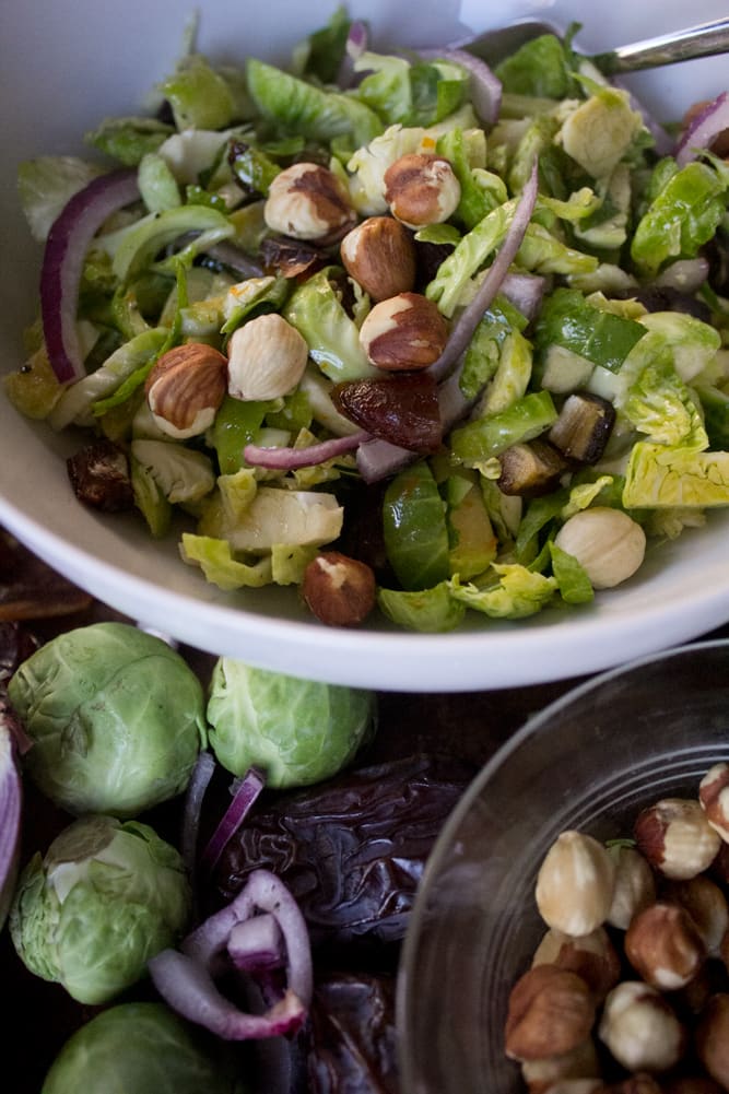 Brussels Sprout Salad with Bacon + Dates + Hazelnuts with shaved red onion