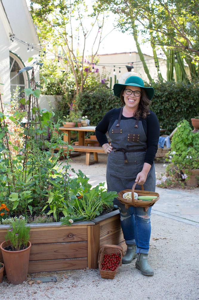 Ashley Irene, founder of Heirloom Potager standing in the Showcase Garden in Floral Park Santa Ana, CA | Photo by Nicole Kent. All rights reserved.