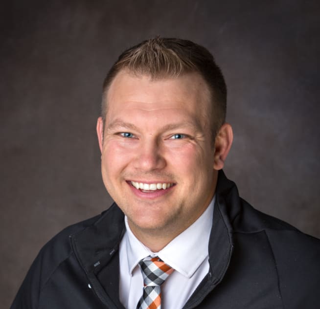 A headshot of Dr. Travis Hall, DPT