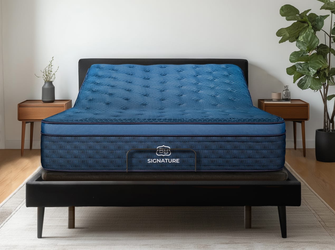 the Ascension® Luxe Adjustable Power Base with the head section raised in a modern bedroom.