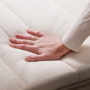 The Plush Organic Mattress topper on top of a mattress