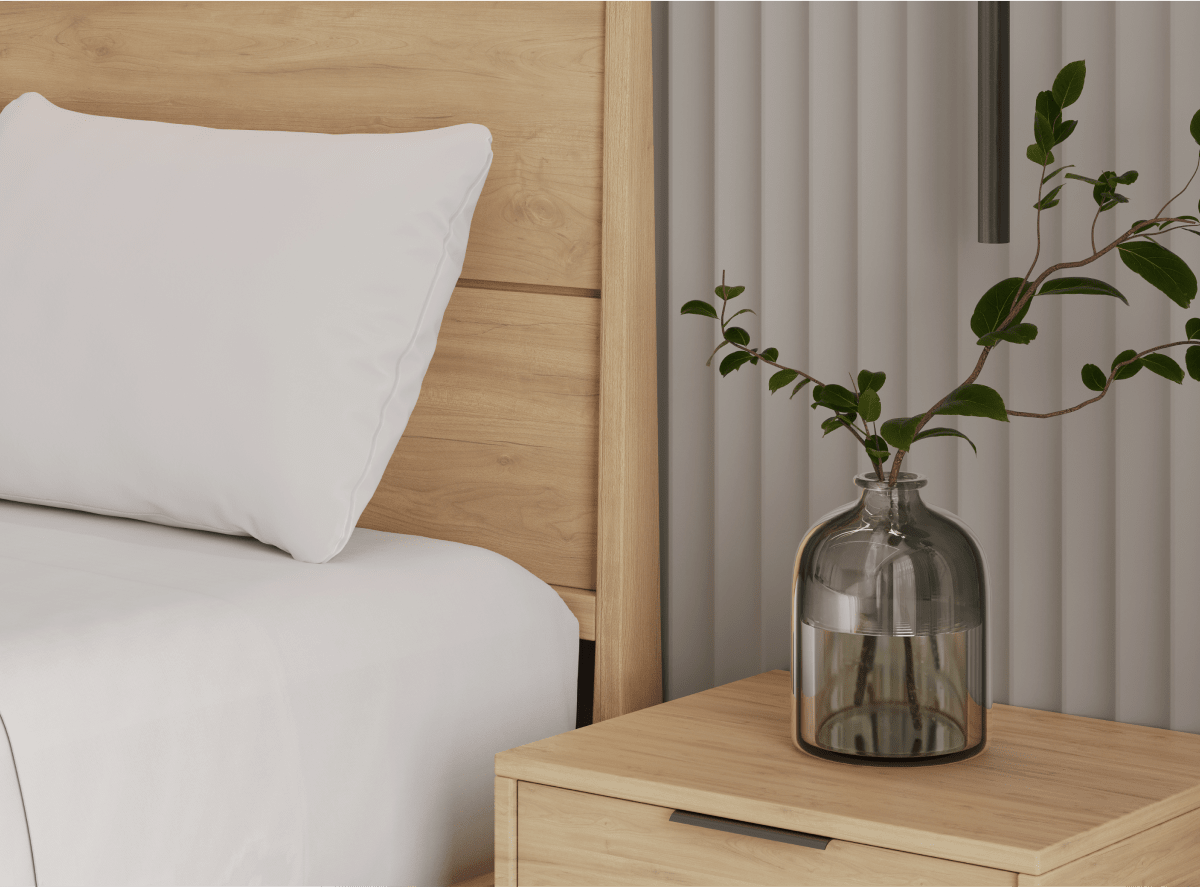 A render of the Ludlow bed frame in light brown in a bedroom scene