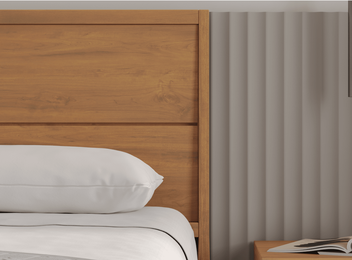 A render of the Ludlow bed frame in dark brown in a bedroom scene