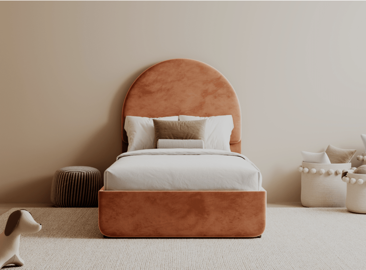 The Helix Astor Bed Frame in a rose color positioned in a bedroom setting