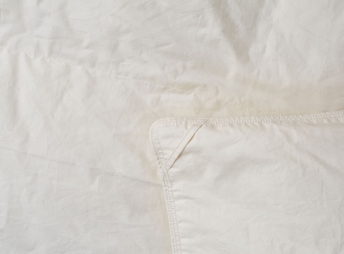 The Birch Natural Down Duvet Insert includes corner loops to tie to a duvet cover