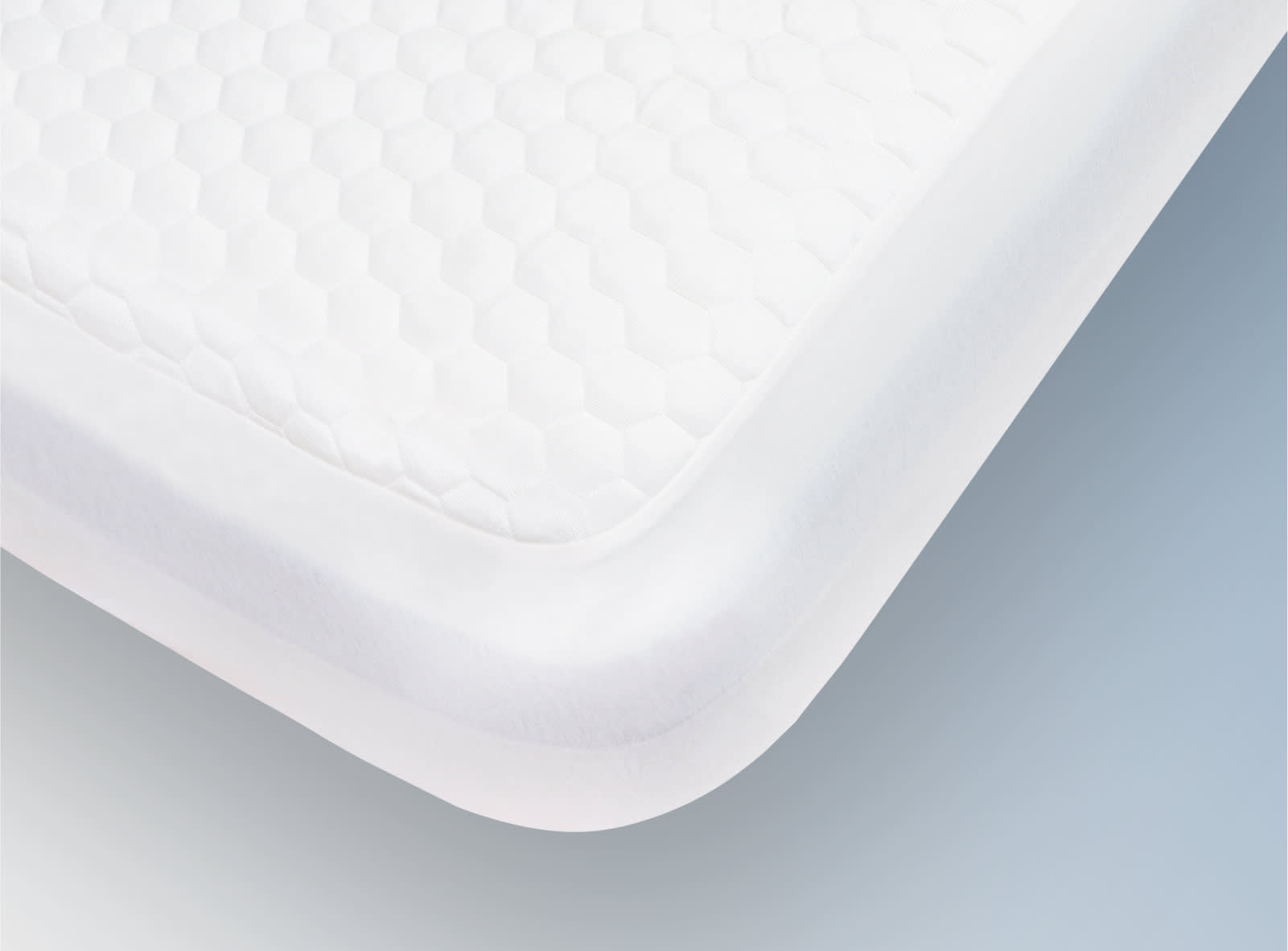 The Helix GlacioTex Waterproof Mattress Protector on a blue background.