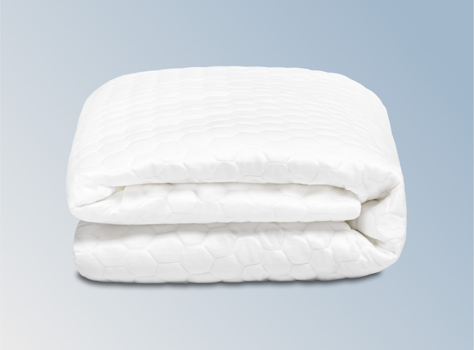 The Helix GlacioTex Waterproof Mattress Protector on a blue background.