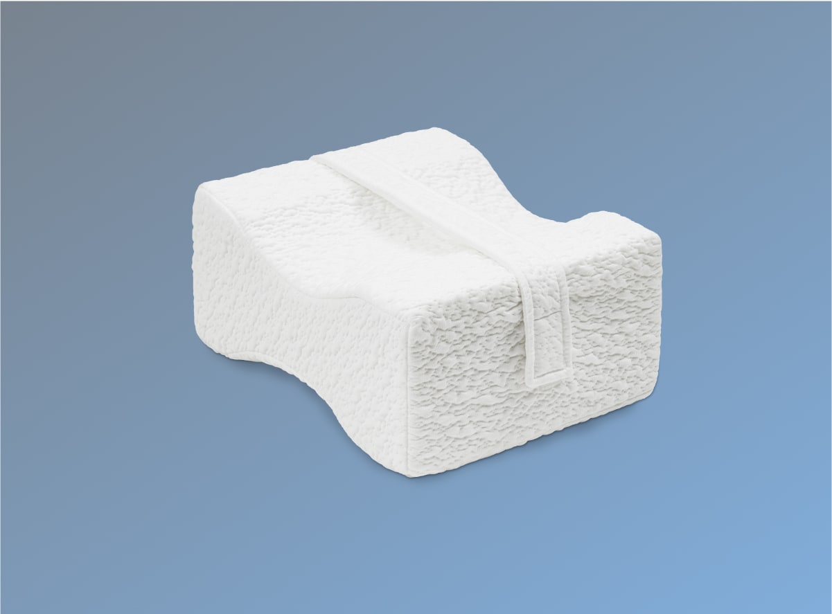 The Helix Side Sleeper Knee Pillow on a blue background
